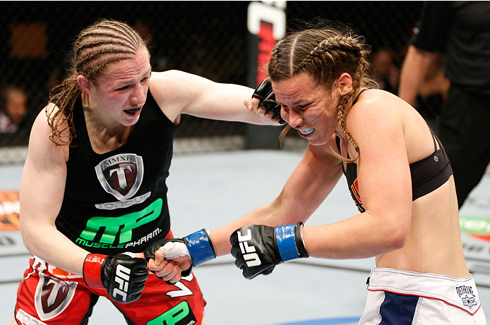 QUEBEC CITY, CANADA - APRIL 16:  (L-R) Sarah Kaufman punches Leslie Smith in their women's bantamweight fight during the TUF Nations Finale at Colisee Pepsi on April 16, 2014 in Quebec City, Quebec, Canada. (Photo by Josh Hedges/Zuffa LLC/Zuffa LLC via Ge