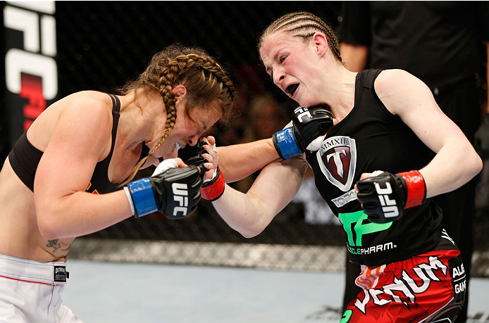 QUEBEC CITY, CANADA - APRIL 16:  (R-L) Sarah Kaufman punches Leslie Smith in their women's bantamweight fight during the TUF Nations Finale at Colisee Pepsi on April 16, 2014 in Quebec City, Quebec, Canada. (Photo by Josh Hedges/Zuffa LLC/Zuffa LLC via Ge