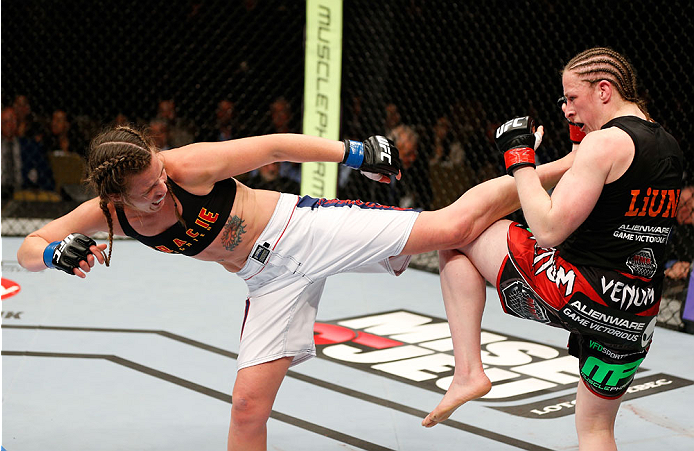 QUEBEC CITY, CANADA - APRIL 16:  (L-R) Leslie Smith kicks Sarah Kaufman in their women's bantamweight fight during the TUF Nations Finale at Colisee Pepsi on April 16, 2014 in Quebec City, Quebec, Canada. (Photo by Josh Hedges/Zuffa LLC/Zuffa LLC via Gett