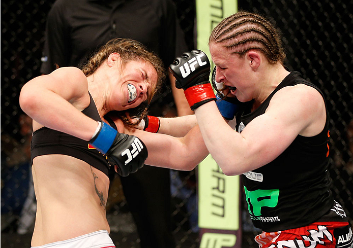 QUEBEC CITY, CANADA - APRIL 16:  (R-L) Sarah Kaufman punches Leslie Smith in their women's bantamweight fight during the TUF Nations Finale at Colisee Pepsi on April 16, 2014 in Quebec City, Quebec, Canada. (Photo by Josh Hedges/Zuffa LLC/Zuffa LLC via Ge