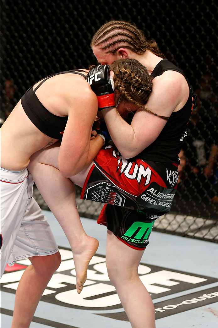 QUEBEC CITY, CANADA - APRIL 16:  (R-L) Sarah Kaufman knees Leslie Smith in their women's bantamweight fight during the TUF Nations Finale at Colisee Pepsi on April 16, 2014 in Quebec City, Quebec, Canada. (Photo by Josh Hedges/Zuffa LLC/Zuffa LLC via Gett