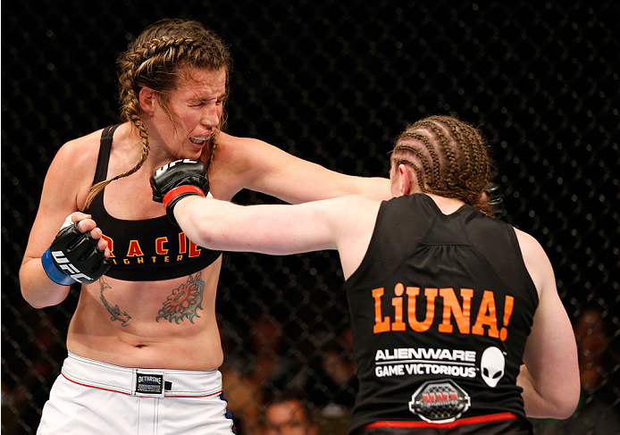 QUEBEC CITY, CANADA - APRIL 16:  (R-L) Sarah Kaufman punches Leslie Smith in their women's bantamweight fight during the TUF Nations Finale at Colisee Pepsi on April 16, 2014 in Quebec City, Quebec, Canada. (Photo by Josh Hedges/Zuffa LLC/Zuffa LLC via Ge