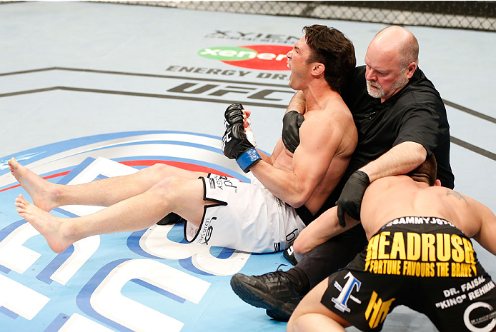 QUEBEC CITY, CANADA - APRIL 16: KJ Noons (L) reacts after his knockout victory over Sam Stout in their welterweight fight during the TUF Nations Finale at Colisee Pepsi on April 16, 2014 in Quebec City, Quebec, Canada. (Photo by Josh Hedges/Zuffa LLC/Zuf