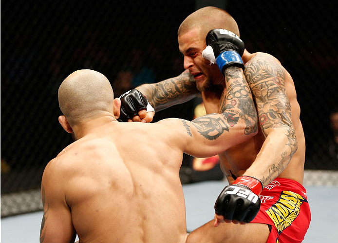 QUEBEC CITY, CANADA - APRIL 16:  (L-R) Akira Corassani punches Dustin Poirier in their featherweight fight during the TUF Nations Finale at Colisee Pepsi on April 16, 2014 in Quebec City, Quebec, Canada. (Photo by Josh Hedges/Zuffa LLC/Zuffa LLC via Getty