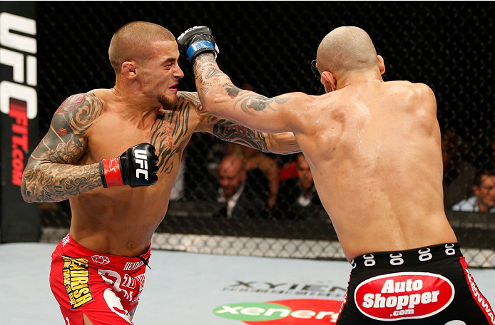 QUEBEC CITY, CANADA - APRIL 16:  (L-R) Dustin Poirier punches Akira Corassani in their featherweight fight during the TUF Nations Finale at Colisee Pepsi on April 16, 2014 in Quebec City, Quebec, Canada. (Photo by Josh Hedges/Zuffa LLC/Zuffa LLC via Getty