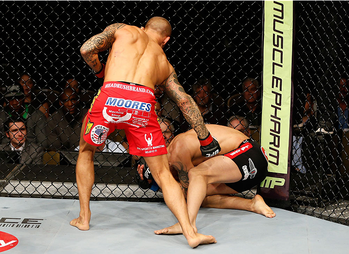 QUEBEC CITY, CANADA - APRIL 16:  (L-R) Dustin Poirier punches Akira Corassani in their featherweight fight during the TUF Nations Finale at Colisee Pepsi on April 16, 2014 in Quebec City, Quebec, Canada. (Photo by Josh Hedges/Zuffa LLC/Zuffa LLC via Getty