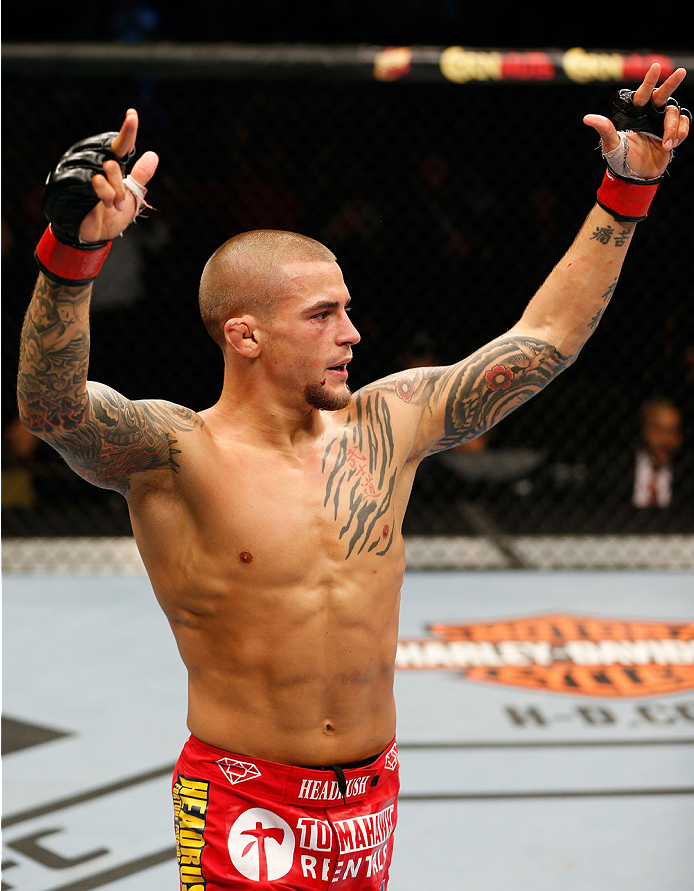 QUEBEC CITY, CANADA - APRIL 16:  Dustin Poirier reacts after his TKO victory over Akira Corassani in their featherweight fight during the TUF Nations Finale at Colisee Pepsi on April 16, 2014 in Quebec City, Quebec, Canada. (Photo by Josh Hedges/Zuffa LLC