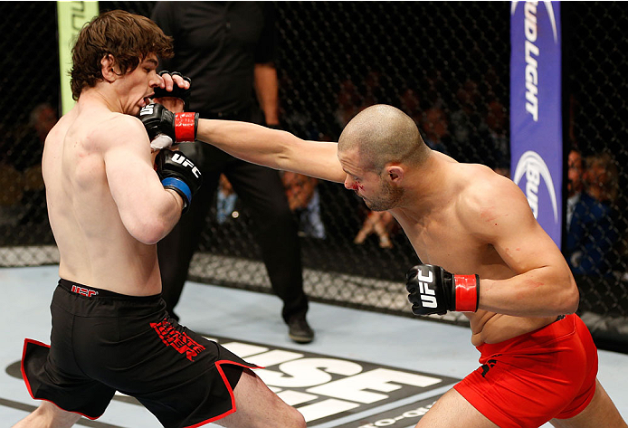 QUEBEC CITY, CANADA - APRIL 16:  (R-L) Chad Laprise punches Olivier Aubin-Mercier in their welterweight fight during the TUF Nations Finale at Colisee Pepsi on April 16, 2014 in Quebec City, Quebec, Canada. (Photo by Josh Hedges/Zuffa LLC/Zuffa LLC via Ge