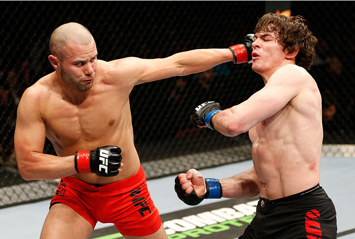 QUEBEC CITY, CANADA - APRIL 16:  (L-R) Chad Laprise punches Olivier Aubin-Mercier in their welterweight fight during the TUF Nations Finale at Colisee Pepsi on April 16, 2014 in Quebec City, Quebec, Canada. (Photo by Josh Hedges/Zuffa LLC/Zuffa LLC via Ge