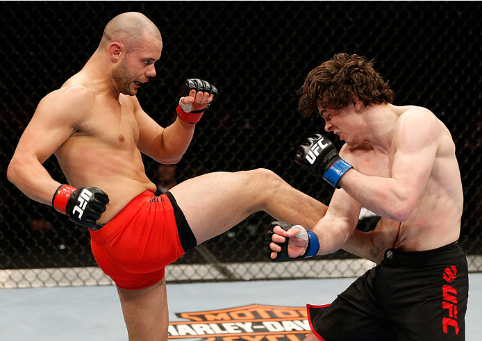 QUEBEC CITY, CANADA - APRIL 16:  (L-R) Chad Laprise kicks Olivier Aubin-Mercier in their welterweight fight during the TUF Nations Finale at Colisee Pepsi on April 16, 2014 in Quebec City, Quebec, Canada. (Photo by Josh Hedges/Zuffa LLC/Zuffa LLC via Gett