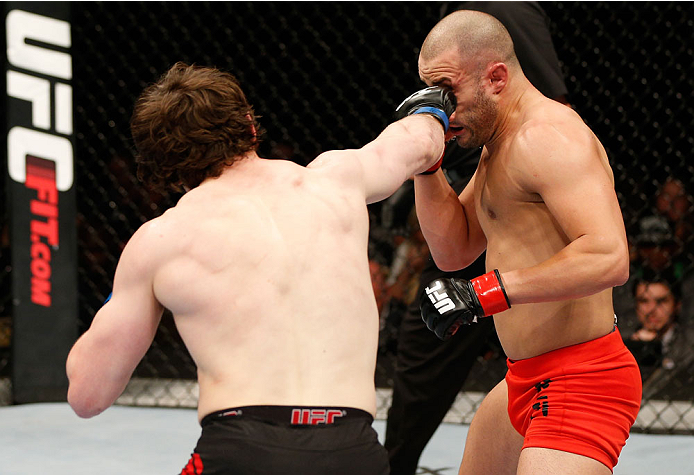 QUEBEC CITY, CANADA - APRIL 16:  (L-R) Olivier Aubin-Mercier punches Chad Laprise in their welterweight fight during the TUF Nations Finale at Colisee Pepsi on April 16, 2014 in Quebec City, Quebec, Canada. (Photo by Josh Hedges/Zuffa LLC/Zuffa LLC via Ge