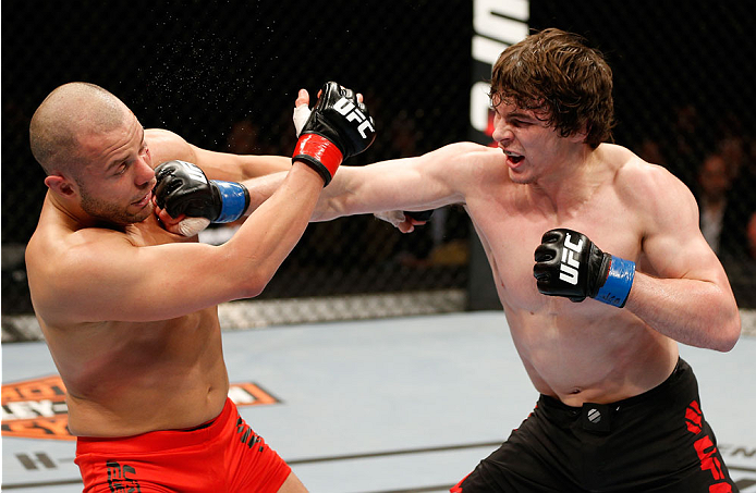 QUEBEC CITY, CANADA - APRIL 16:  (R-L) Olivier Aubin-Mercier punches Chad Laprise in their welterweight fight during the TUF Nations Finale at Colisee Pepsi on April 16, 2014 in Quebec City, Quebec, Canada. (Photo by Josh Hedges/Zuffa LLC/Zuffa LLC via Ge