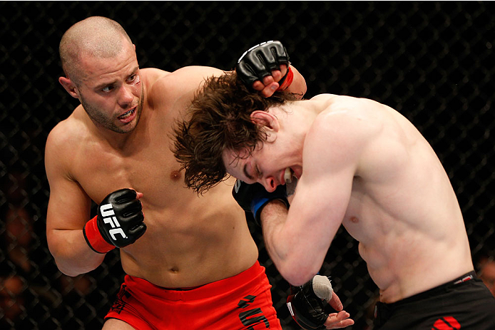 QUEBEC CITY, CANADA - APRIL 16:  (L-R) Chad Laprise punches Olivier Aubin-Mercier in their welterweight fight during the TUF Nations Finale at Colisee Pepsi on April 16, 2014 in Quebec City, Quebec, Canada. (Photo by Josh Hedges/Zuffa LLC/Zuffa LLC via Ge