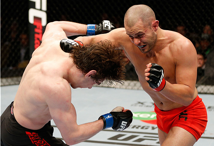 QUEBEC CITY, CANADA - APRIL 16:  (R-L) Chad Laprise punches Olivier Aubin-Mercier in their welterweight fight during the TUF Nations Finale at Colisee Pepsi on April 16, 2014 in Quebec City, Quebec, Canada. (Photo by Josh Hedges/Zuffa LLC/Zuffa LLC via Ge