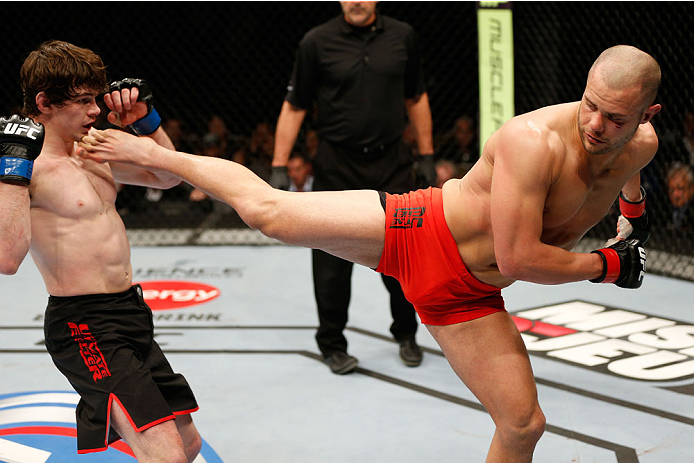 QUEBEC CITY, CANADA - APRIL 16:  (R-L) Chad Laprise kicks Olivier Aubin-Mercier in their welterweight fight during the TUF Nations Finale at Colisee Pepsi on April 16, 2014 in Quebec City, Quebec, Canada. (Photo by Josh Hedges/Zuffa LLC/Zuffa LLC via Gett