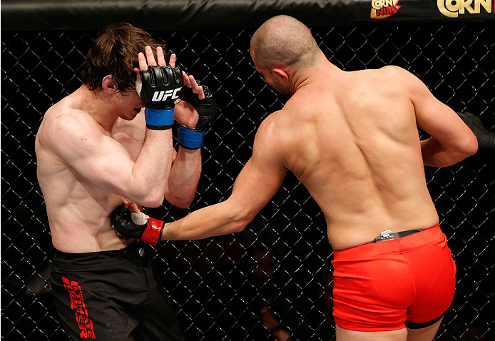 QUEBEC CITY, CANADA - APRIL 16:  (R-L) Chad Laprise punches Olivier Aubin-Mercier in their welterweight fight during the TUF Nations Finale at Colisee Pepsi on April 16, 2014 in Quebec City, Quebec, Canada. (Photo by Josh Hedges/Zuffa LLC/Zuffa LLC via Ge