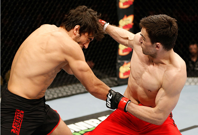 QUEBEC CITY, CANADA - APRIL 16:  (R-L) Sheldon Wescott punches Elias Theodorou in their middleweight fight during the TUF Nations Finale at Colisee Pepsi on April 16, 2014 in Quebec City, Quebec, Canada. (Photo by Josh Hedges/Zuffa LLC/Zuffa LLC via Getty