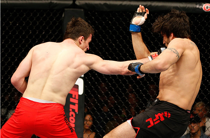 QUEBEC CITY, CANADA - APRIL 16:  (L-R) Sheldon Wescott punches Elias Theodorou in their middleweight fight during the TUF Nations Finale at Colisee Pepsi on April 16, 2014 in Quebec City, Quebec, Canada. (Photo by Josh Hedges/Zuffa LLC/Zuffa LLC via Getty