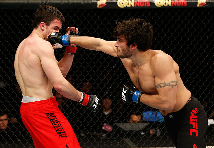 QUEBEC CITY, CANADA - APRIL 16:  (R-L) Elias Theodorou punches Sheldon Wescott in their middleweight fight during the TUF Nations Finale at Colisee Pepsi on April 16, 2014 in Quebec City, Quebec, Canada. (Photo by Josh Hedges/Zuffa LLC/Zuffa LLC via Getty