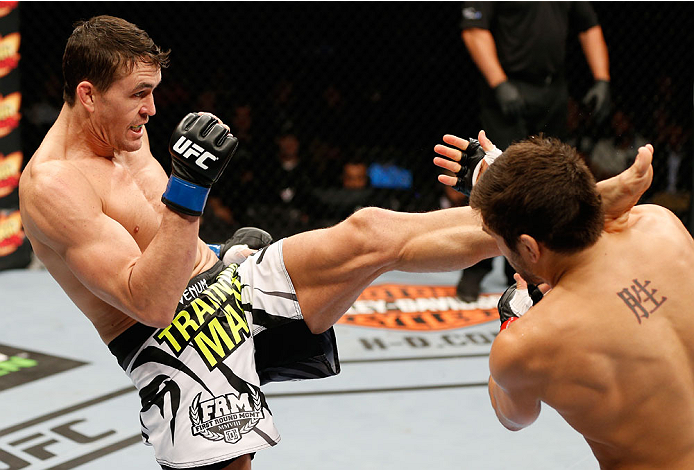 QUEBEC CITY, CANADA - APRIL 16:  (L-R) Kyle Noke kicks Patrick Cote in their welterweight fight during the TUF Nations Finale at Colisee Pepsi on April 16, 2014 in Quebec City, Quebec, Canada. (Photo by Josh Hedges/Zuffa LLC/Zuffa LLC via Getty Images)