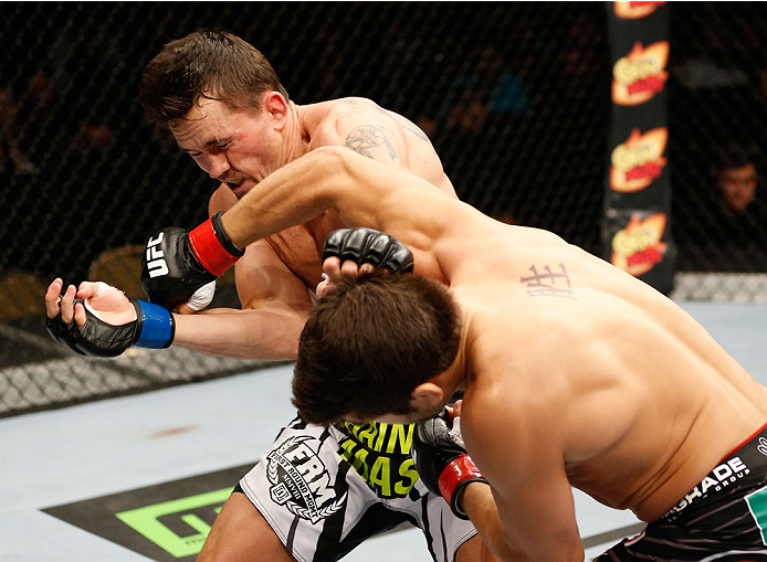 QUEBEC CITY, CANADA - APRIL 16:  (R-L) Patrick Cote punches Kyle Noke in their welterweight fight during the TUF Nations Finale at Colisee Pepsi on April 16, 2014 in Quebec City, Quebec, Canada. (Photo by Josh Hedges/Zuffa LLC/Zuffa LLC via Getty Images)