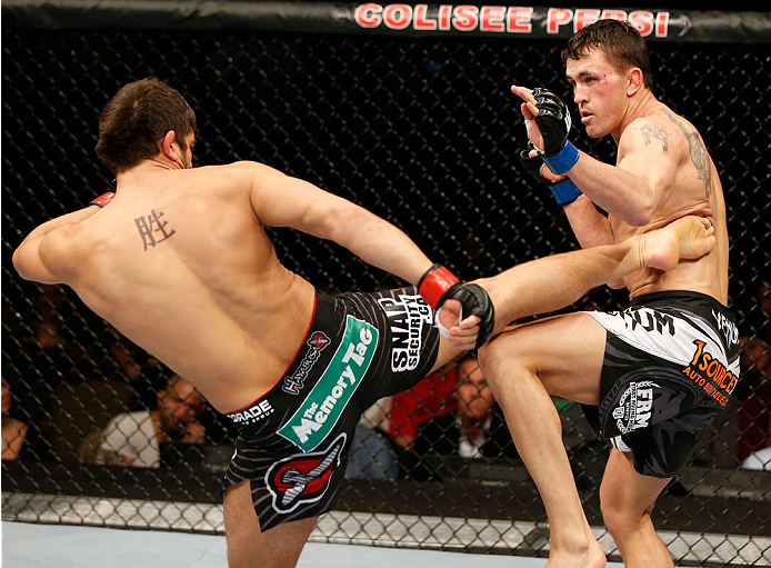 QUEBEC CITY, CANADA - APRIL 16:  (L-R) Patrick Cote kicks Kyle Noke in their welterweight fight during the TUF Nations Finale at Colisee Pepsi on April 16, 2014 in Quebec City, Quebec, Canada. (Photo by Josh Hedges/Zuffa LLC/Zuffa LLC via Getty Images)