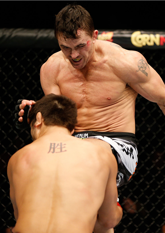 QUEBEC CITY, CANADA - APRIL 16:  (R-L) Kyle Noke knees Patrick Cote in their welterweight fight during the TUF Nations Finale at Colisee Pepsi on April 16, 2014 in Quebec City, Quebec, Canada. (Photo by Josh Hedges/Zuffa LLC/Zuffa LLC via Getty Images)