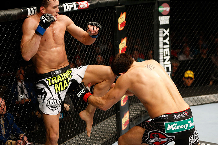 QUEBEC CITY, CANADA - APRIL 16:  (L-R) Kyle Noke knees Patrick Cote in their welterweight fight during the TUF Nations Finale at Colisee Pepsi on April 16, 2014 in Quebec City, Quebec, Canada. (Photo by Josh Hedges/Zuffa LLC/Zuffa LLC via Getty Images)