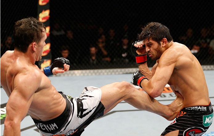 QUEBEC CITY, CANADA - APRIL 16:  (L-R) Kyle Noke kicks Patrick Cote in their welterweight fight during the TUF Nations Finale at Colisee Pepsi on April 16, 2014 in Quebec City, Quebec, Canada. (Photo by Josh Hedges/Zuffa LLC/Zuffa LLC via Getty Images)