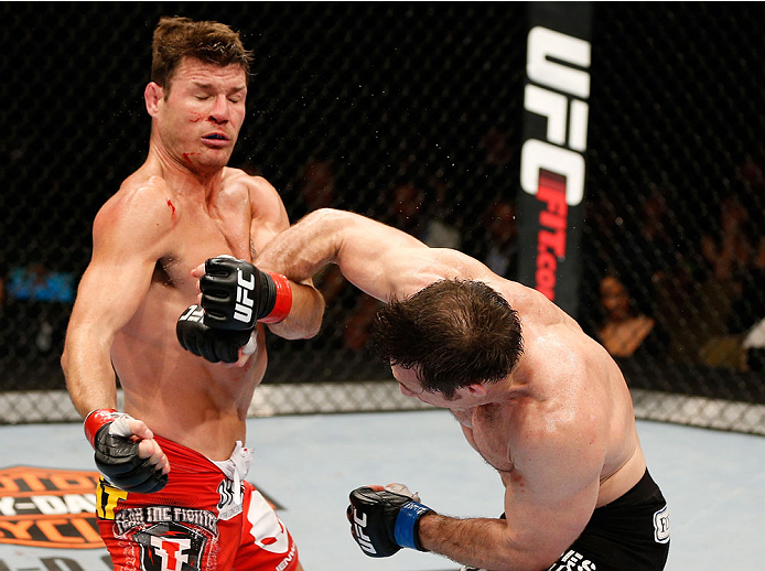 QUEBEC CITY, CANADA - APRIL 16:  (R-L) Tim Kennedy punches Michael Bisping in their middleweight fight during the TUF Nations Finale at Colisee Pepsi on April 16, 2014 in Quebec City, Quebec, Canada. (Photo by Josh Hedges/Zuffa LLC/Zuffa LLC via Getty Ima