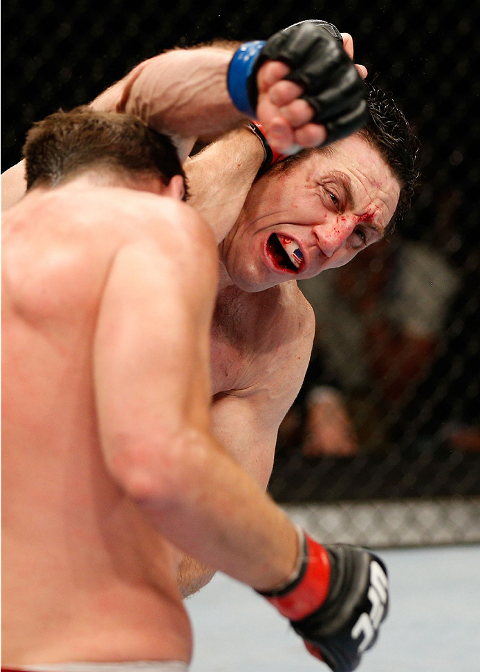 QUEBEC CITY, CANADA - APRIL 16:  (R-L) Tim Kennedy and Michael Bisping trade punches in their middleweight fight during the TUF Nations Finale at Colisee Pepsi on April 16, 2014 in Quebec City, Quebec, Canada. (Photo by Josh Hedges/Zuffa LLC/Zuffa LLC via