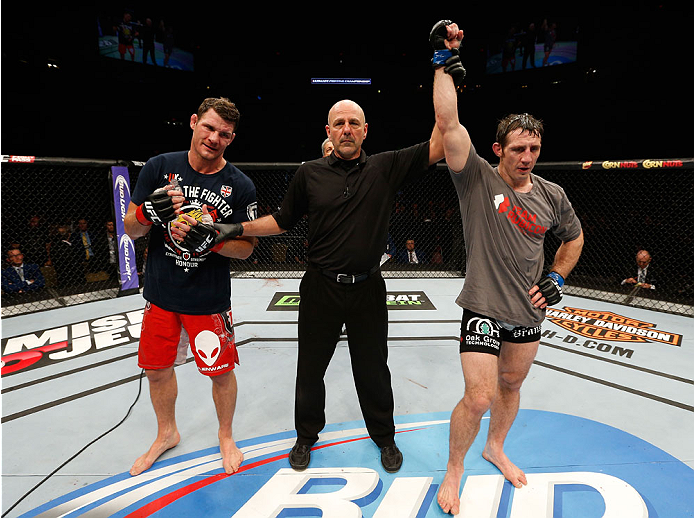 QUEBEC CITY, CANADA - APRIL 16:  Tim Kennedy (R) reacts after his decision victory over Michael Bisping in their middleweight fight during the TUF Nations Finale at Colisee Pepsi on April 16, 2014 in Quebec City, Quebec, Canada. (Photo by Josh Hedges/Zuff