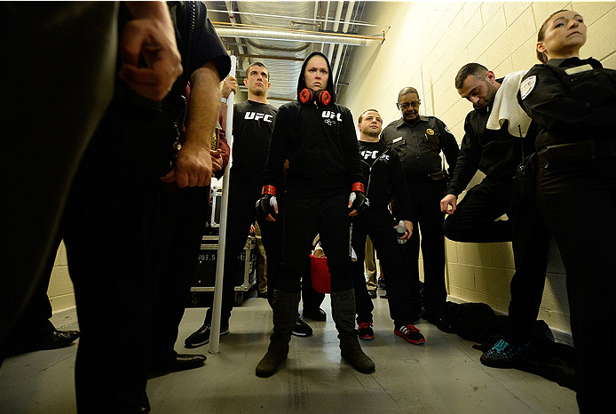 LAS VEGAS, NV - FEBRUARY 22: Ronda Rousey (center) prepares to face Sara McMann in their women's bantamweight championship bout during UFC 170 inside the Mandalay Bay Events Center on February 22, 2014 in Las Vegas, Nevada. (Photo by Jeff Bottari/Zuffa L