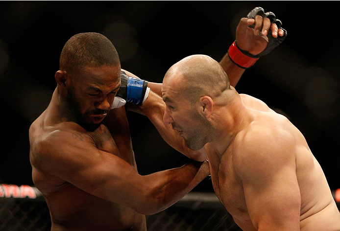 BALTIMORE, MD - APRIL 26:  (R-L) Glover Teixeira punches Jon "Bones" Jones in their light heavyweight championship bout during the UFC 172 event at the Baltimore Arena on April 26, 2014 in Baltimore, Maryland. (Photo by Josh Hedges/Zuffa LLC/Zuffa LLC via