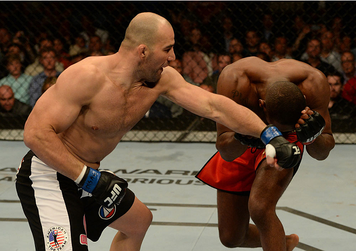 BALTIMORE, MD - APRIL 26:  (L-R) Glover Teixeira punches Jon "Bones" Jones in their light heavyweight championship bout during the UFC 172 event at the Baltimore Arena on April 26, 2014 in Baltimore, Maryland. (Photo by Patrick Smith/Zuffa LLC/Zuffa LLC v