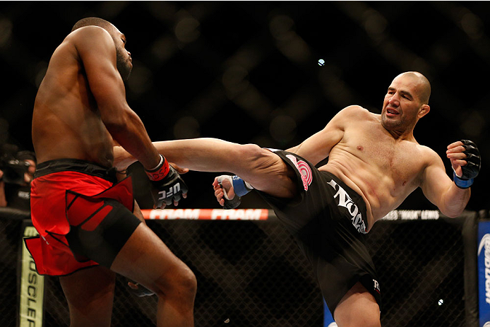 BALTIMORE, MD - APRIL 26:  (R-L) Glover Teixeira kicks Jon "Bones" Jones in their light heavyweight championship bout during the UFC 172 event at the Baltimore Arena on April 26, 2014 in Baltimore, Maryland. (Photo by Josh Hedges/Zuffa LLC/Zuffa LLC via G