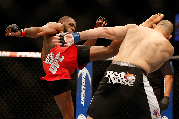 BALTIMORE, MD - APRIL 26:  (L-R) Jon "Bones" Jones kicks Glover Teixeira in their light heavyweight championship bout during the UFC 172 event at the Baltimore Arena on April 26, 2014 in Baltimore, Maryland. (Photo by Josh Hedges/Zuffa LLC/Zuffa LLC via G