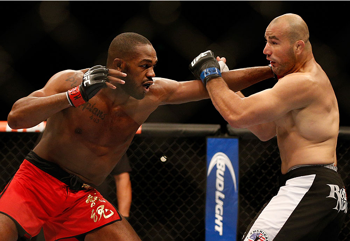 BALTIMORE, MD - APRIL 26:  (L-R) Jon "Bones" Jones punches Glover Teixeira in their light heavyweight championship bout during the UFC 172 event at the Baltimore Arena on April 26, 2014 in Baltimore, Maryland. (Photo by Josh Hedges/Zuffa LLC/Zuffa LLC via