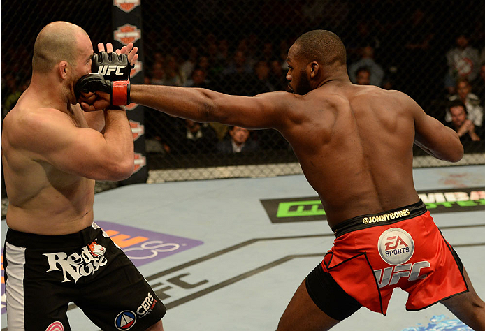 BALTIMORE, MD - APRIL 26:  (R-L) Jon "Bones" Jones punches Glover Teixeira in their light heavyweight championship bout during the UFC 172 event at the Baltimore Arena on April 26, 2014 in Baltimore, Maryland. (Photo by Patrick Smith/Zuffa LLC/Zuffa LLC v