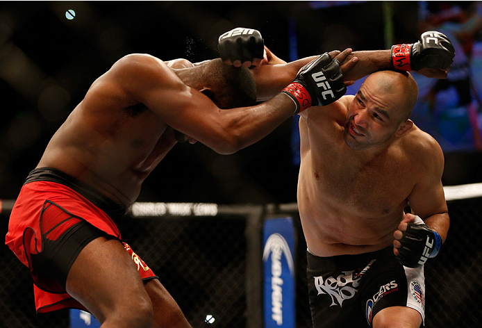 BALTIMORE, MD - APRIL 26:  (R-L) Glover Teixeira punches Jon "Bones" Jones in their light heavyweight championship bout during the UFC 172 event at the Baltimore Arena on April 26, 2014 in Baltimore, Maryland. (Photo by Josh Hedges/Zuffa LLC/Zuffa LLC via