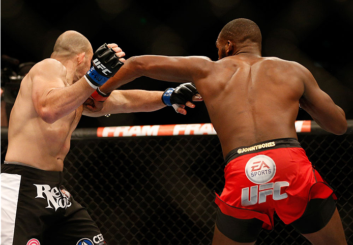 BALTIMORE, MD - APRIL 26:  (R-L) Jon "Bones" Jones punches Glover Teixeira in their light heavyweight championship bout during the UFC 172 event at the Baltimore Arena on April 26, 2014 in Baltimore, Maryland. (Photo by Josh Hedges/Zuffa LLC/Zuffa LLC via