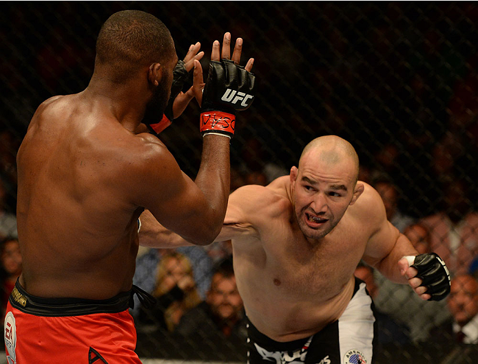 BALTIMORE, MD - APRIL 26:  (R-L) Glover Teixeira punches Jon "Bones" Jones in their light heavyweight championship bout during the UFC 172 event at the Baltimore Arena on April 26, 2014 in Baltimore, Maryland. (Photo by Patrick Smith/Zuffa LLC/Zuffa LLC v