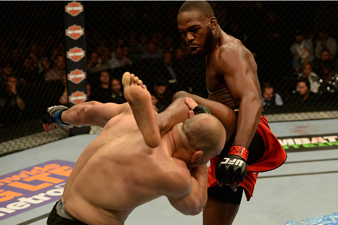 BALTIMORE, MD - APRIL 26:  (R-L) Jon "Bones" Jones kicks Glover Teixeira in their light heavyweight championship bout during the UFC 172 event at the Baltimore Arena on April 26, 2014 in Baltimore, Maryland. (Photo by Patrick Smith/Zuffa LLC/Zuffa LLC via