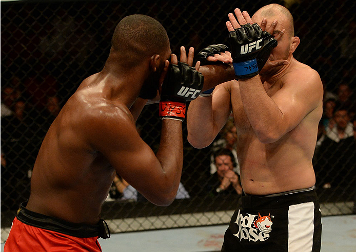 BALTIMORE, MD - APRIL 26:  (L-R) Jon "Bones" Jones paws at Glover Teixeira with his hand in their light heavyweight championship bout during the UFC 172 event at the Baltimore Arena on April 26, 2014 in Baltimore, Maryland. (Photo by Patrick Smith/Zuffa L