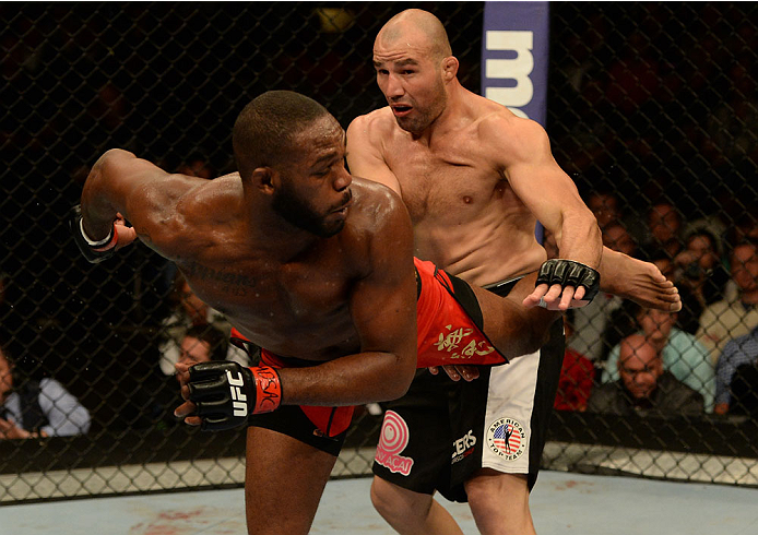 BALTIMORE, MD - APRIL 26:  (L-R) Jon "Bones" Jones kicks Glover Teixeira in their light heavyweight championship bout during the UFC 172 event at the Baltimore Arena on April 26, 2014 in Baltimore, Maryland. (Photo by Patrick Smith/Zuffa LLC/Zuffa LLC via