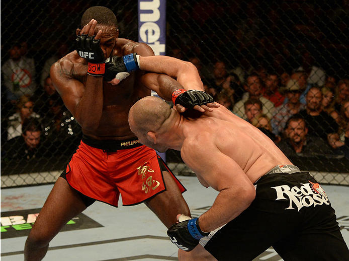 BALTIMORE, MD - APRIL 26:  (R-L) Glover Teixeira punches Jon "Bones" Jones in their light heavyweight championship bout during the UFC 172 event at the Baltimore Arena on April 26, 2014 in Baltimore, Maryland. (Photo by Patrick Smith/Zuffa LLC/Zuffa LLC v