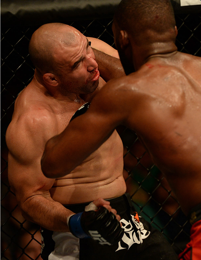 BALTIMORE, MD - APRIL 26:  (L-R) Glover Teixeira punches Jon "Bones" Jones in their light heavyweight championship bout during the UFC 172 event at the Baltimore Arena on April 26, 2014 in Baltimore, Maryland. (Photo by Patrick Smith/Zuffa LLC/Zuffa LLC v