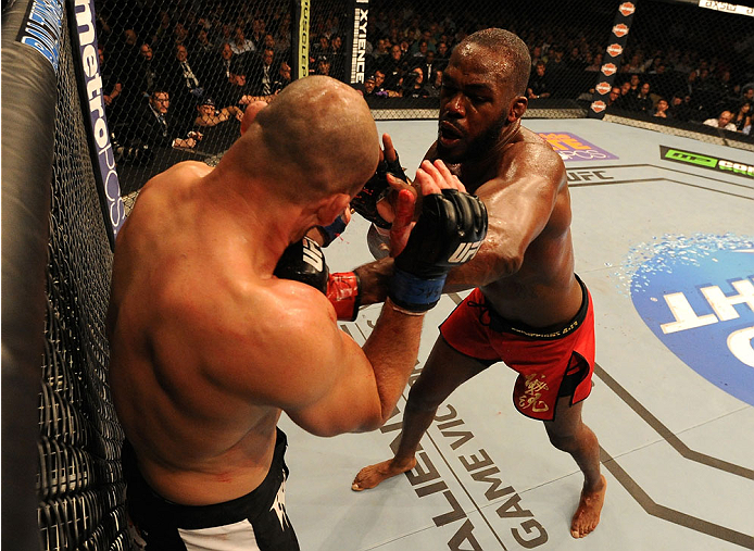 BALTIMORE, MD - APRIL 26:  (R-L) Jon "Bones" Jones punches Glover Teixeira in their light heavyweight championship bout during the UFC 172 event at the Baltimore Arena on April 26, 2014 in Baltimore, Maryland. (Photo by Patrick Smith/Zuffa LLC/Zuffa LLC v