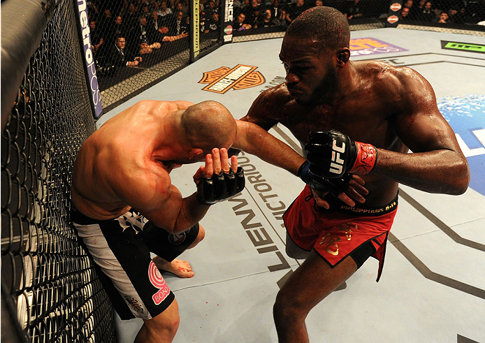 BALTIMORE, MD - APRIL 26:  (R-L) Jon "Bones" Jones punches Glover Teixeira in their light heavyweight championship bout during the UFC 172 event at the Baltimore Arena on April 26, 2014 in Baltimore, Maryland. (Photo by Patrick Smith/Zuffa LLC/Zuffa LLC v