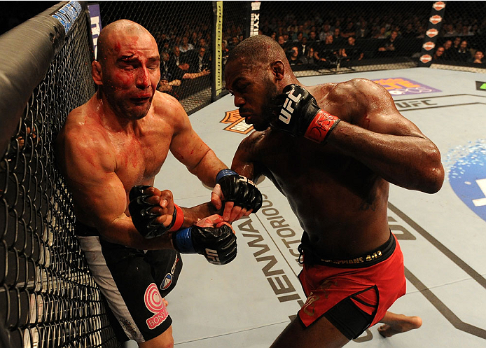 BALTIMORE, MD - APRIL 26:  (R-L) Jon "Bones" Jones punches Glover Teixeira in their light heavyweight championship bout during the UFC 172 event at the Baltimore Arena on April 26, 2014 in Baltimore, Maryland. (Photo by Patrick Smith/Zuffa LLC/Zuffa LLC v